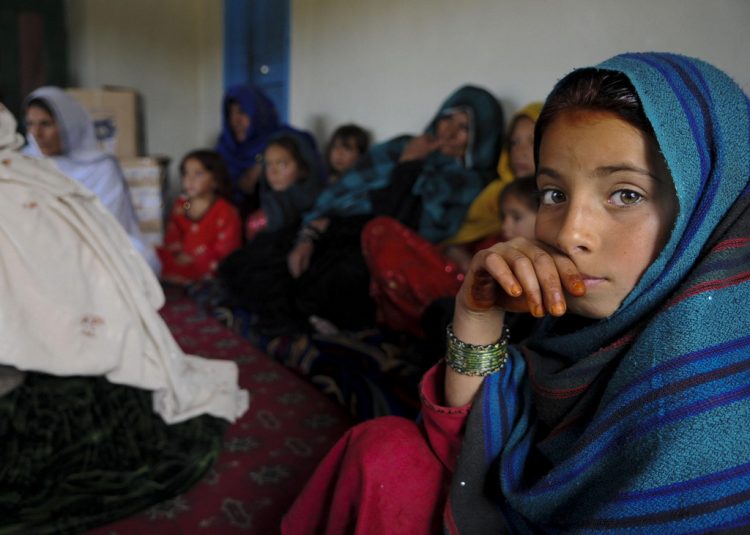 An Afghan girl attends a female engagement team meeting in Balish Kalay Village, Urgun District, Afghanistan, March 27. Women and children attended the meeting with the FET of Paktika Provincial Reconstruction Team to discuss major issues and concerns. The FET gathers vital information from Paktika women, and uses that information to help improve their economic, educational and health issues. For the FET, this meeting was a rare opportunity to learn more about the women of Afghanistan.